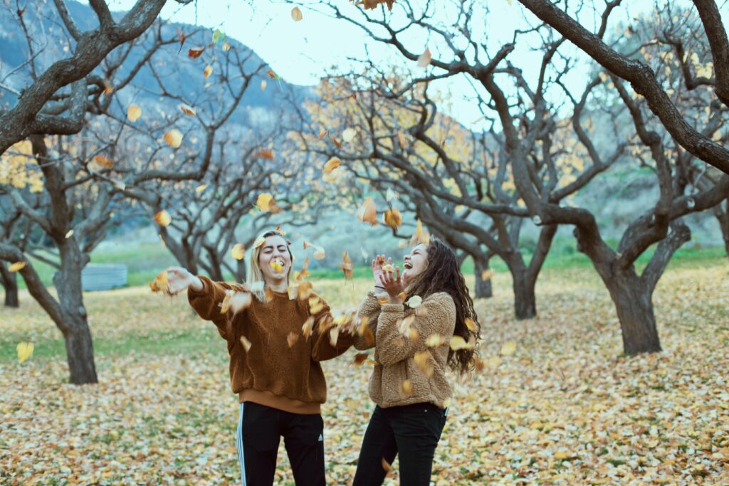 Playing in fall leaves