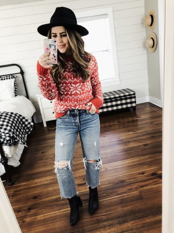 Festive sweater and jeans holiday outfit